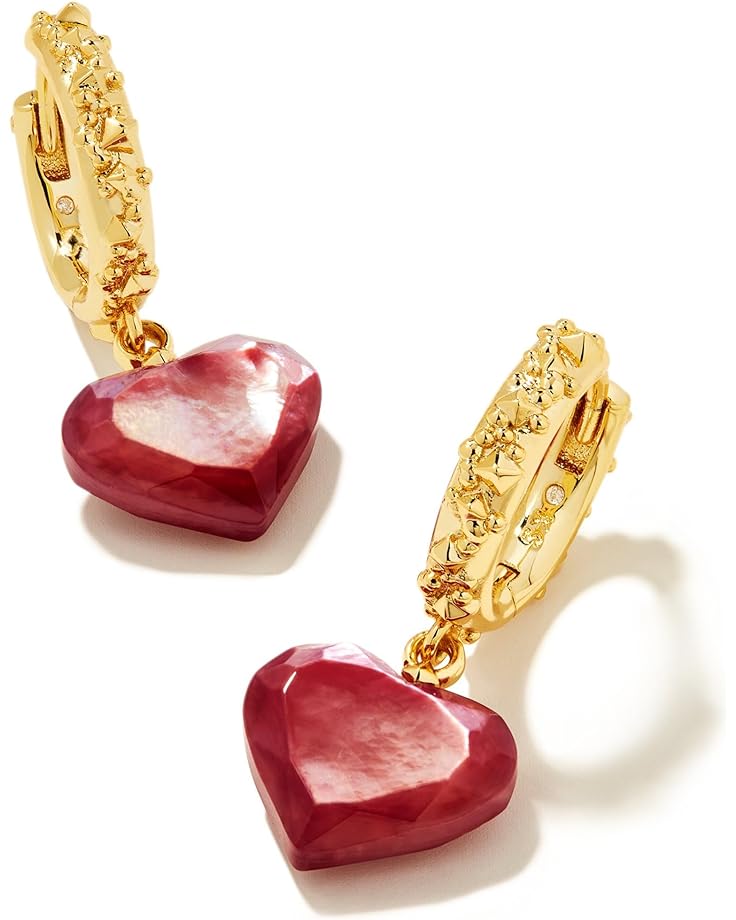 Heart Huggie Earrings with mother of pearl. Petite heart shapes dangle from textured huggies for a style that's as sweet as it is chic. These huggies will add a touch of romance to every look. Made from gold-plated brass metal and cubic zirconia.